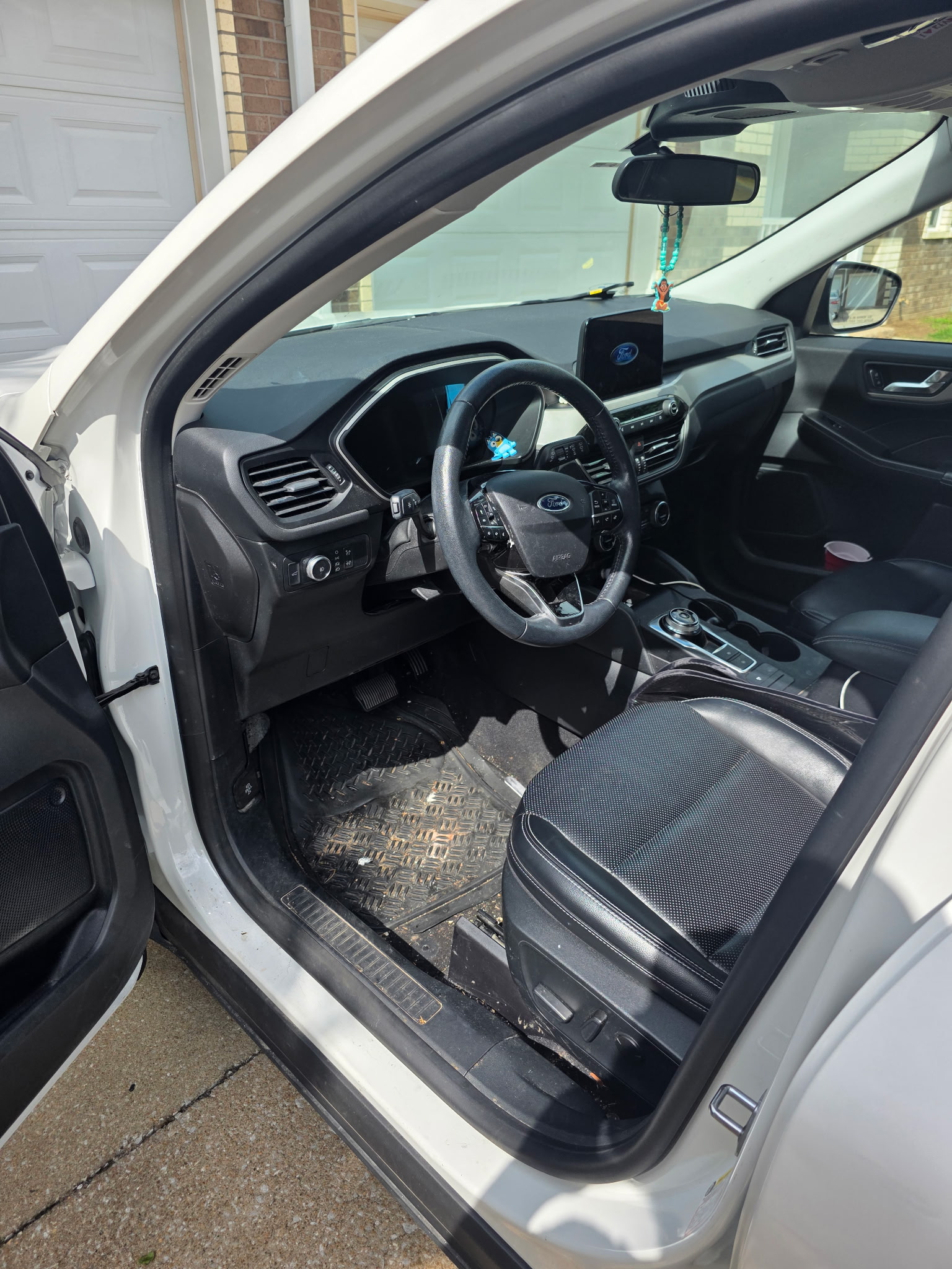 Car interior before detailing in Joplin MO